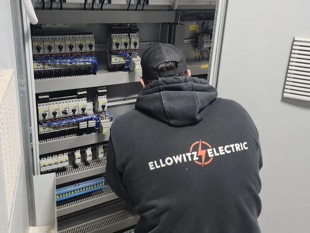 Electrician performing an electric panel Installation.